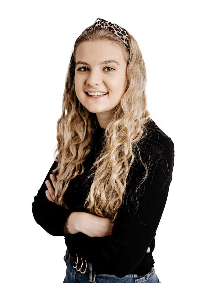 Blonde female student smiling at the camera