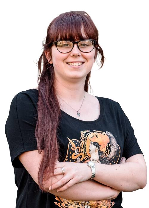 Female student wearing glasses smiling at camera