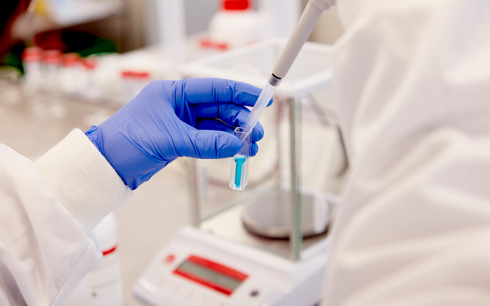 student in biolab with sample