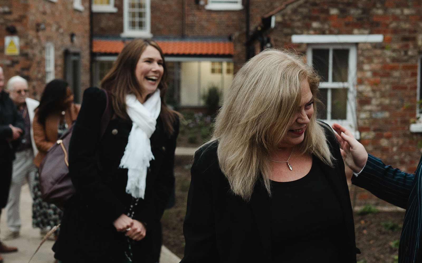 Two attendees at a Communities Centre event.