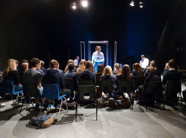 Students watching performance of It's Not OK play