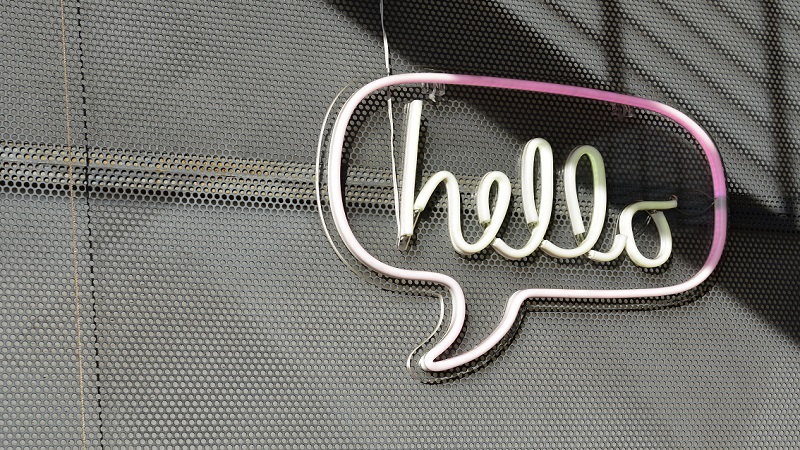 A wall with an LED hello sign