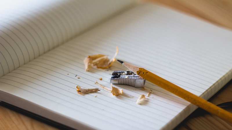 Pencil and sharpener on an open book