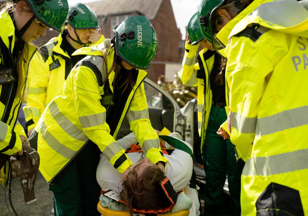 Paramedic Science students working in a simulation together