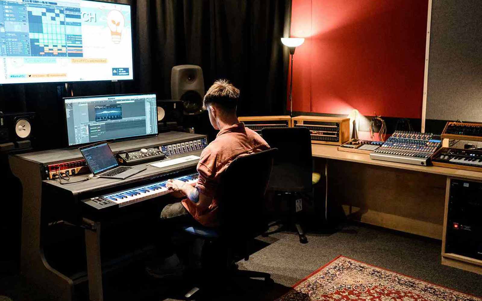 A student using music production technology.