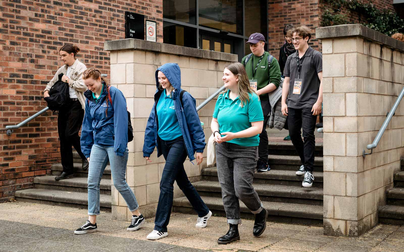 Students and ambassadors walking together on campus.