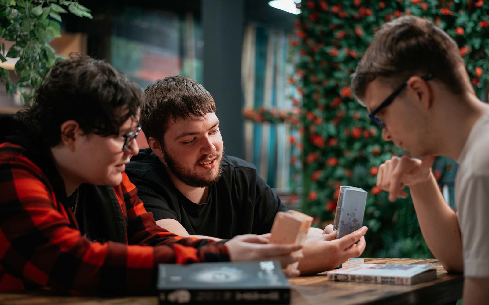 Members of the Anime Society sitting at table talking to each other