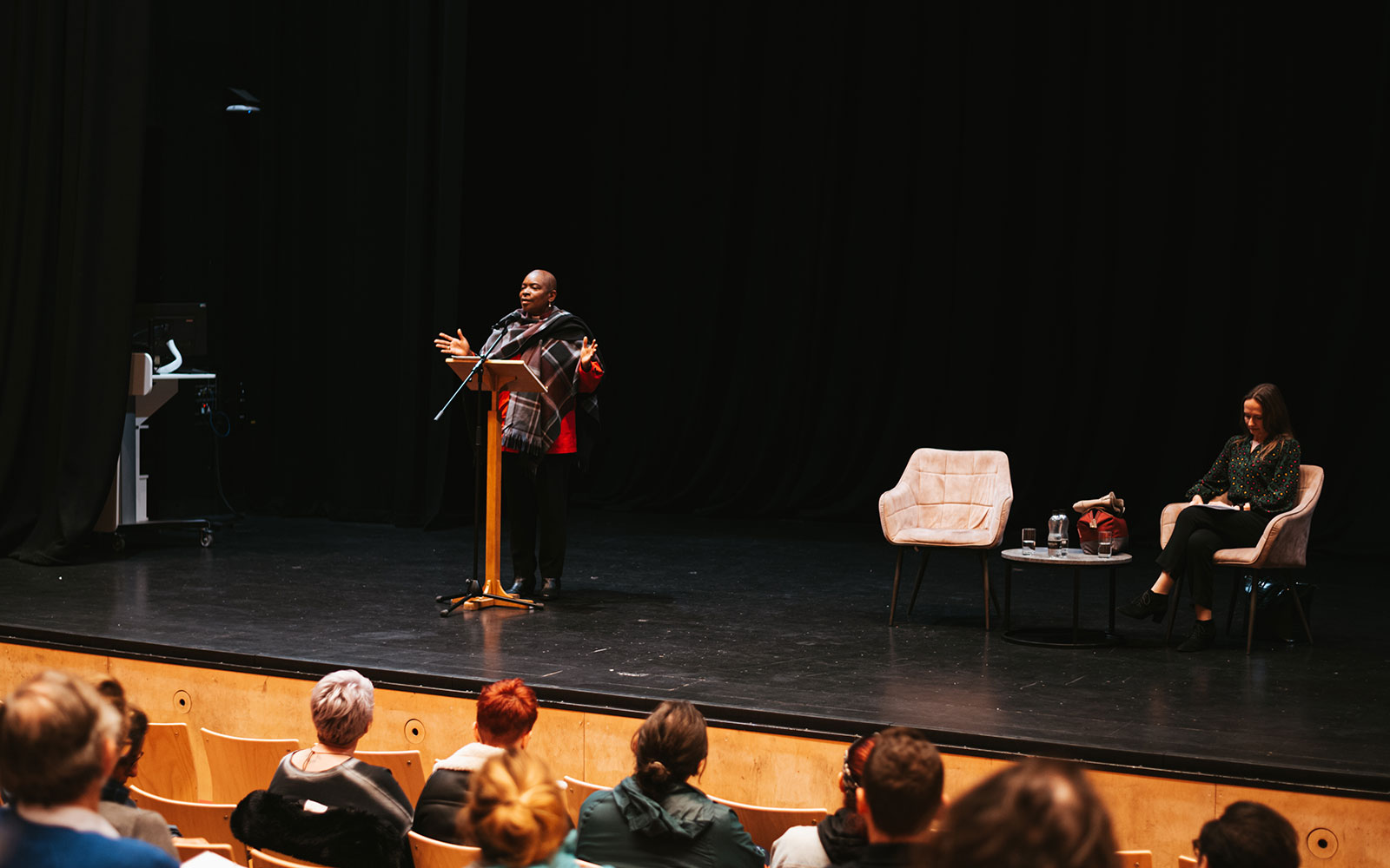 Lecture for Black History Month with Bishop Rose Hudson-Wilkins delivering speech on stage in Creative Centre