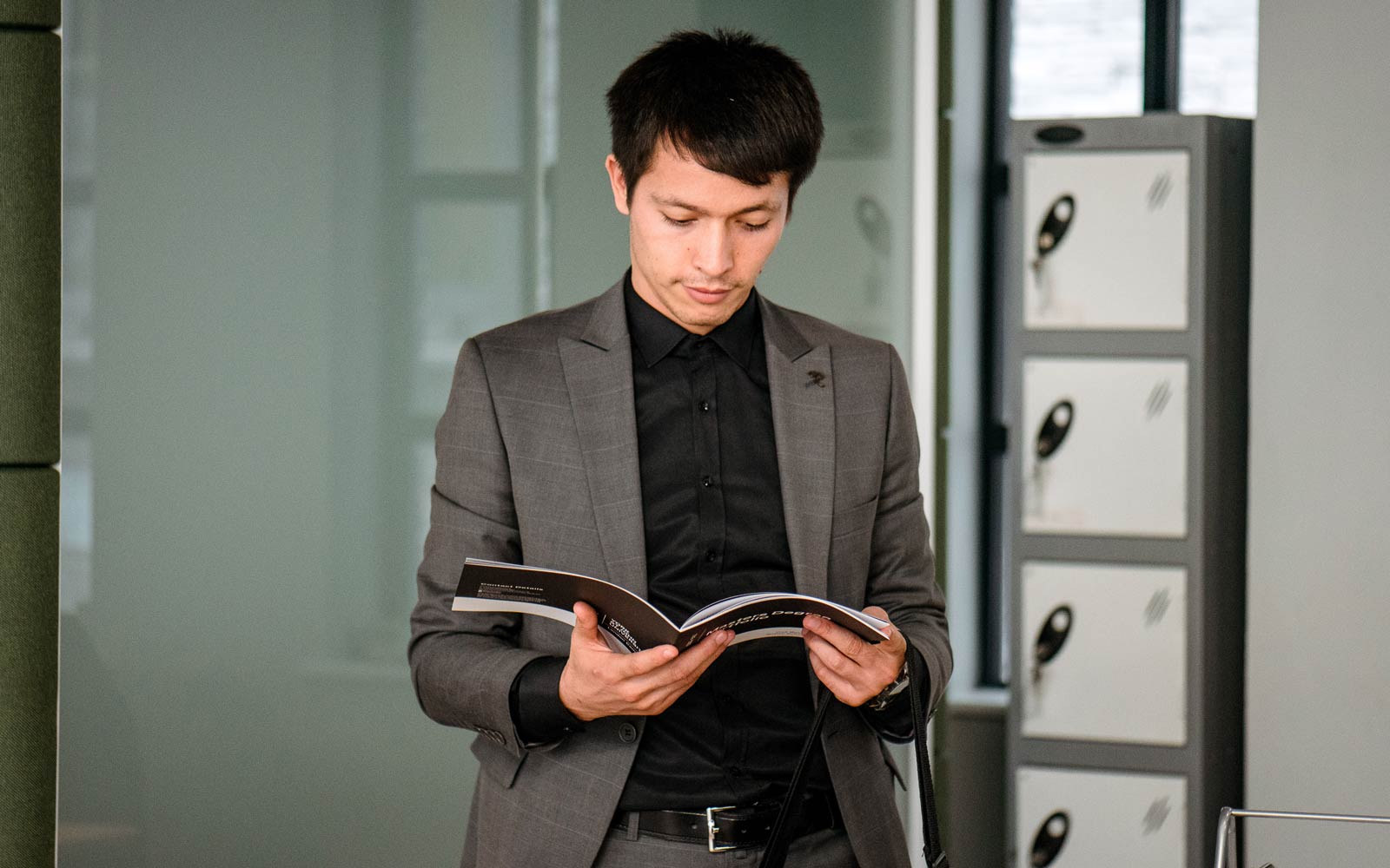 Business owner looking through student work