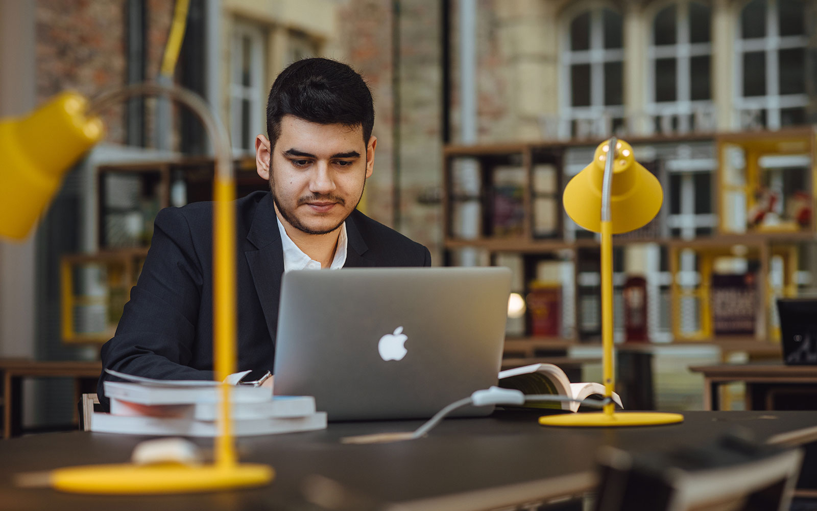 Business student looking at laptop.
