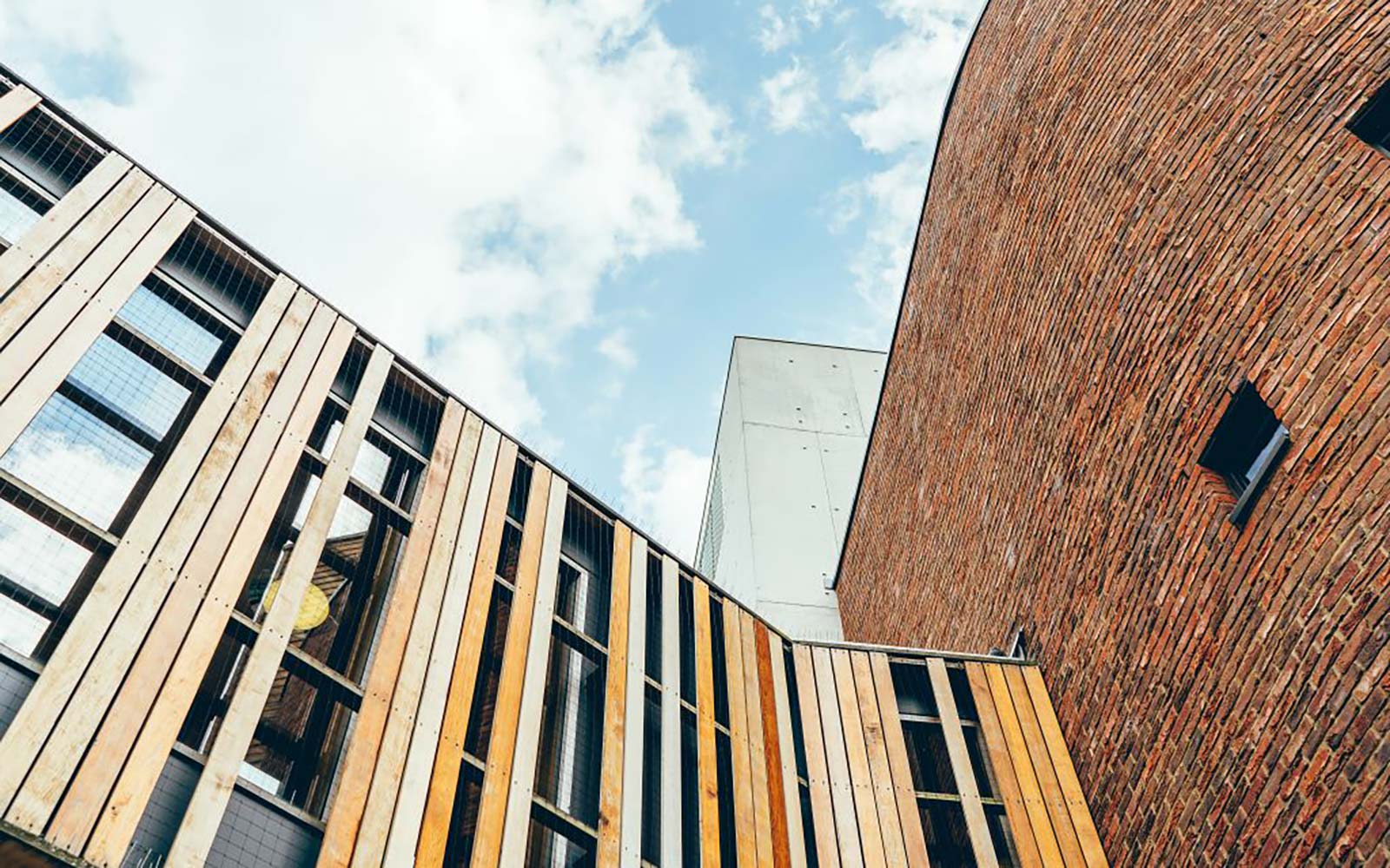 Blue sky and clouds above campus buildings