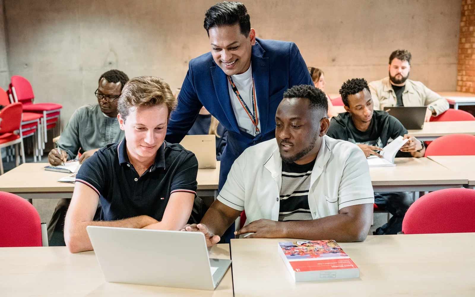 Students and lecturer in classroom.