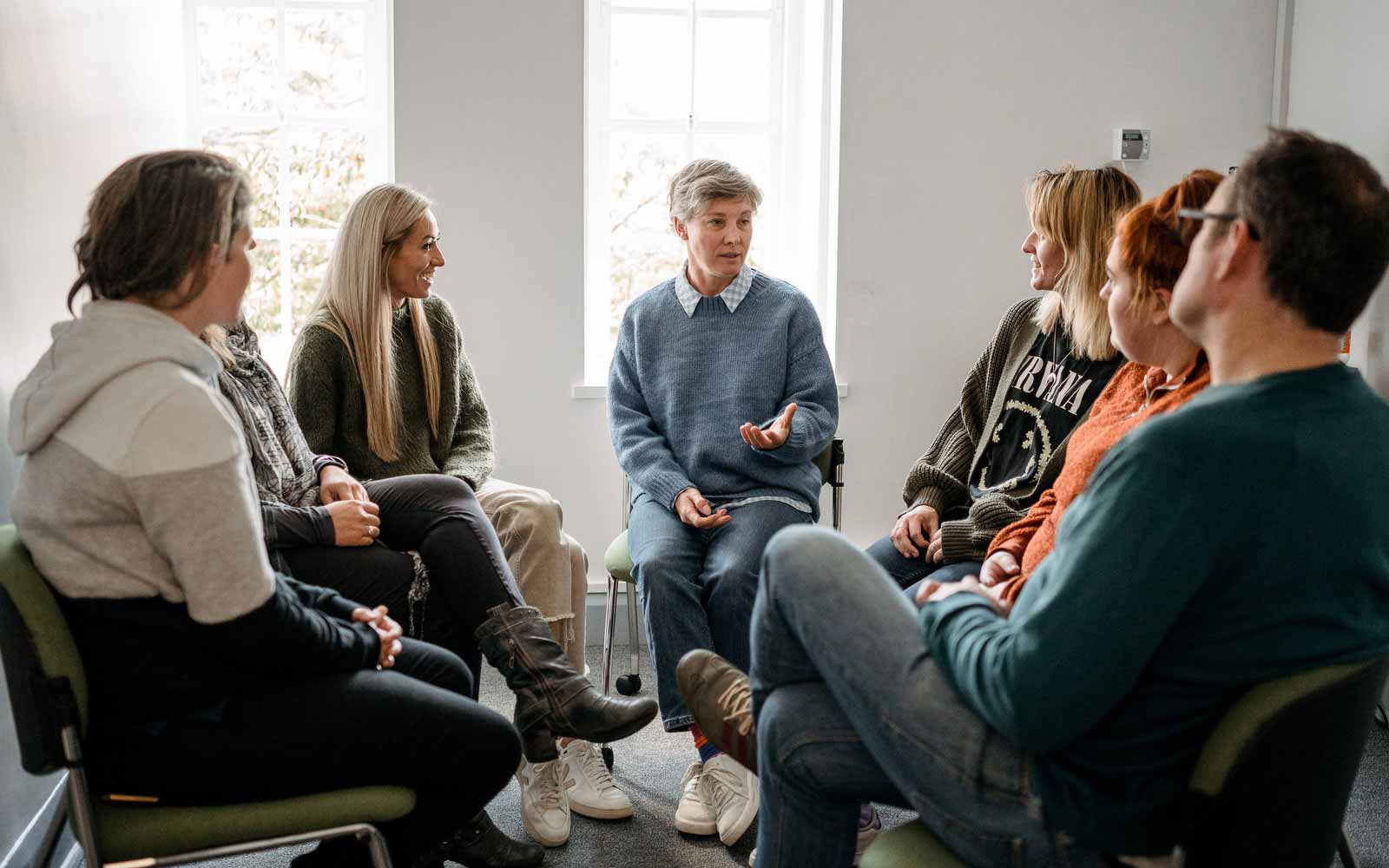 Counselling students sat in circle.