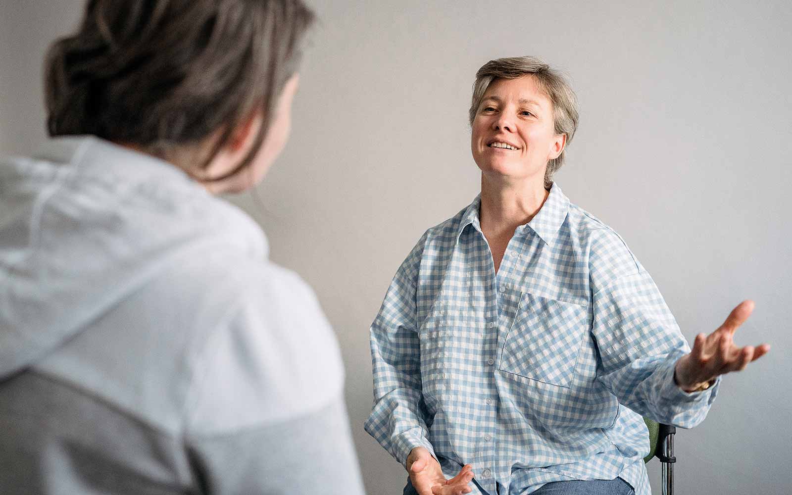 Two women in a counselling discussion.