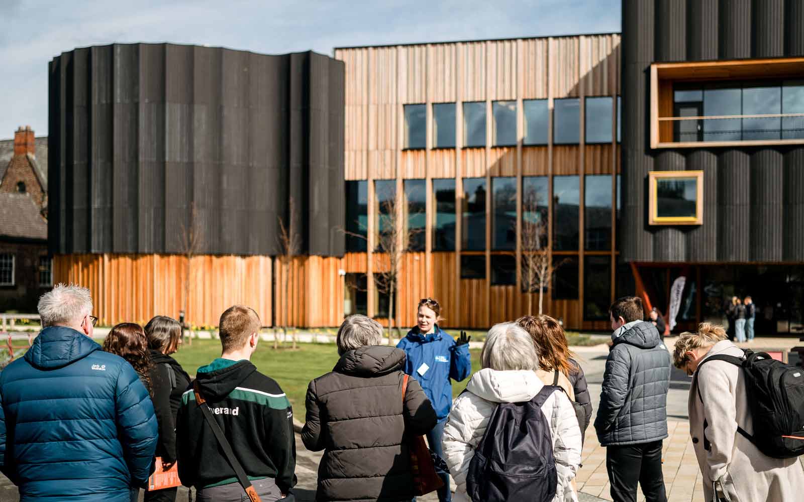 A student ambassador shows people the Creative Centre.