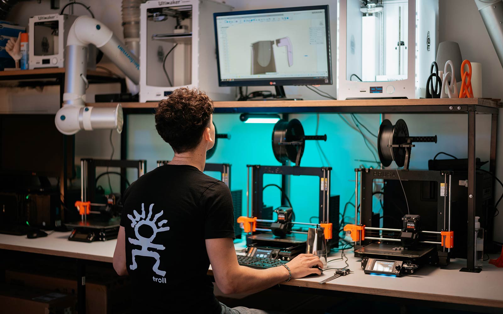 Student working on design equipment in studio