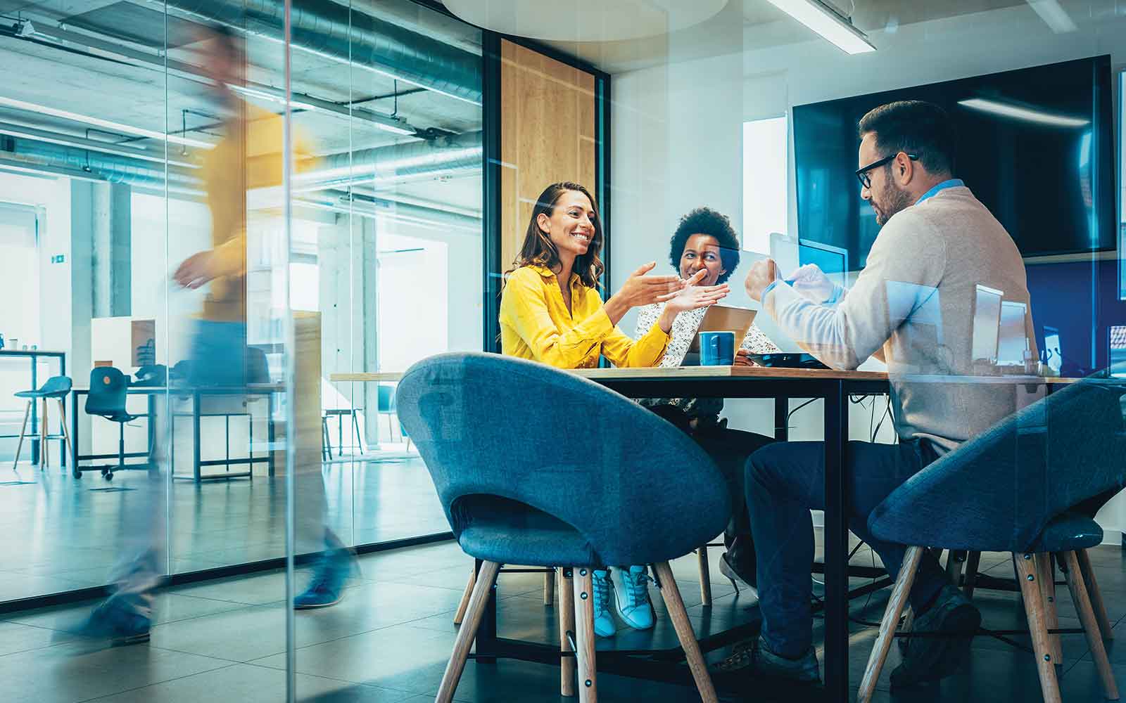 A group of people in a meeting