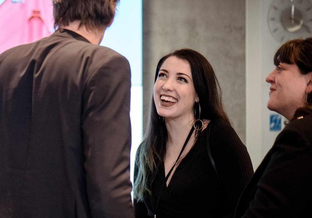 Student smiling at event