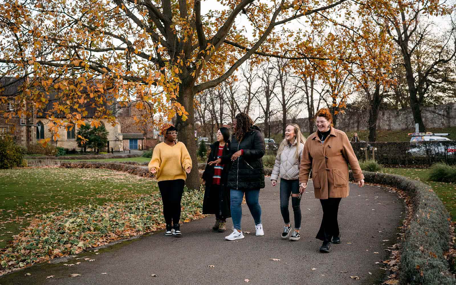 Group of international students walking through campus