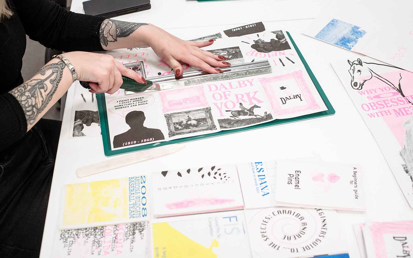 Overhead view of a student creating graphic design work.