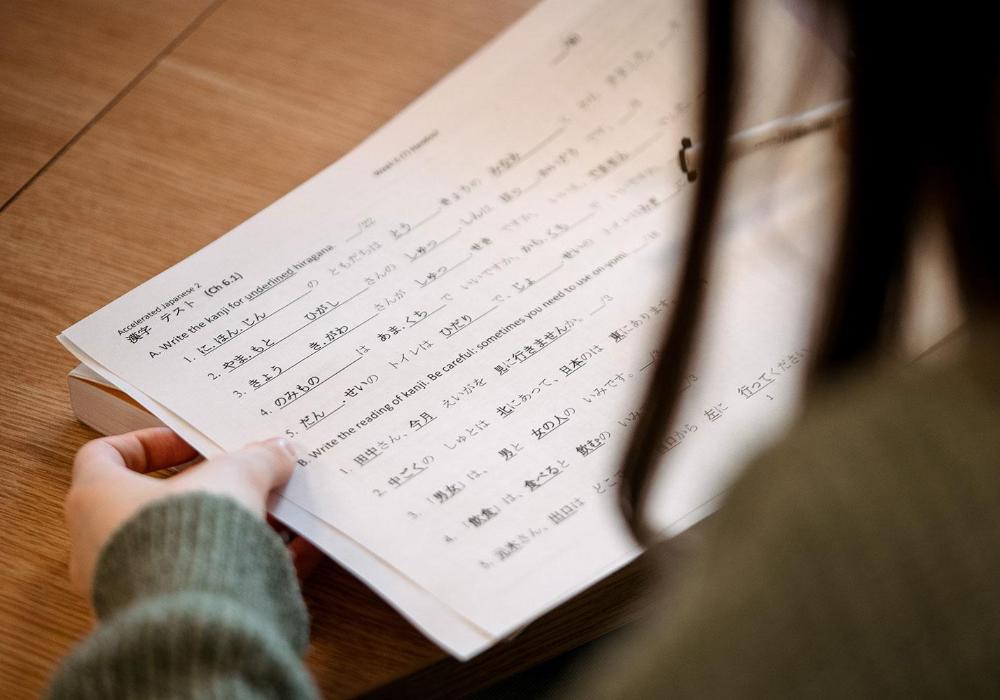 Student filling in Japanese language worksheet
