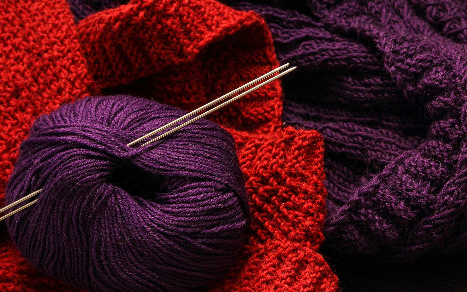 A ball of wool and knitting needles