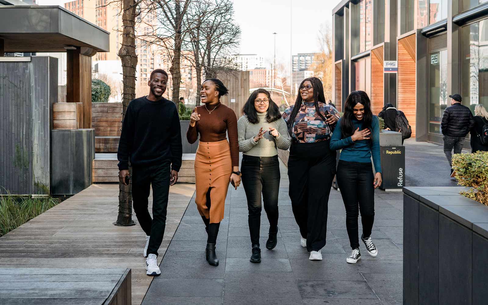 Students walking together at YSJ London campus.
