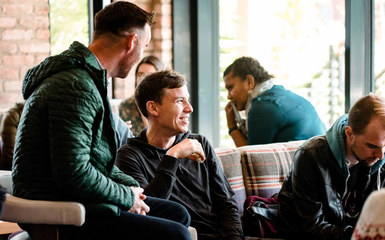 Mature students chatting at an induction event.