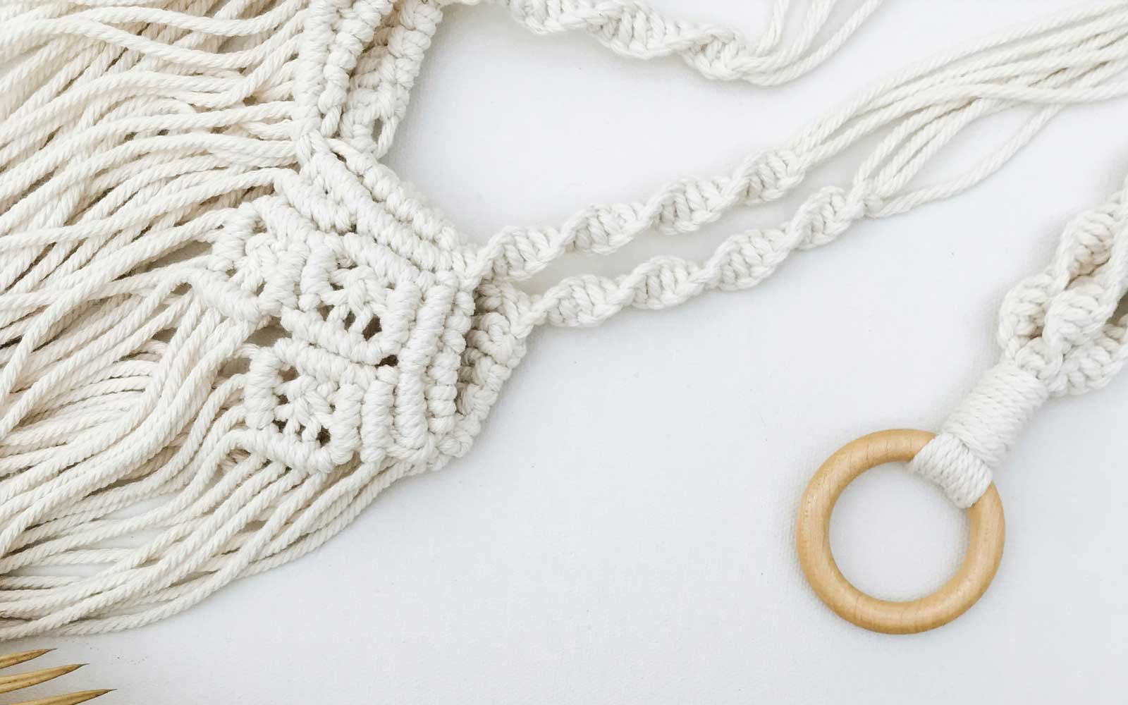Close up of macrame cord woved into a spiral design. Photo by rocknwool on Unsplash.
