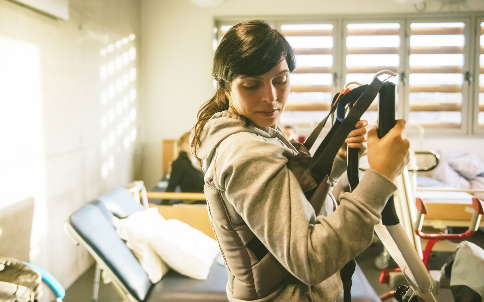 Student in an occupational therapy room using a hoist.
