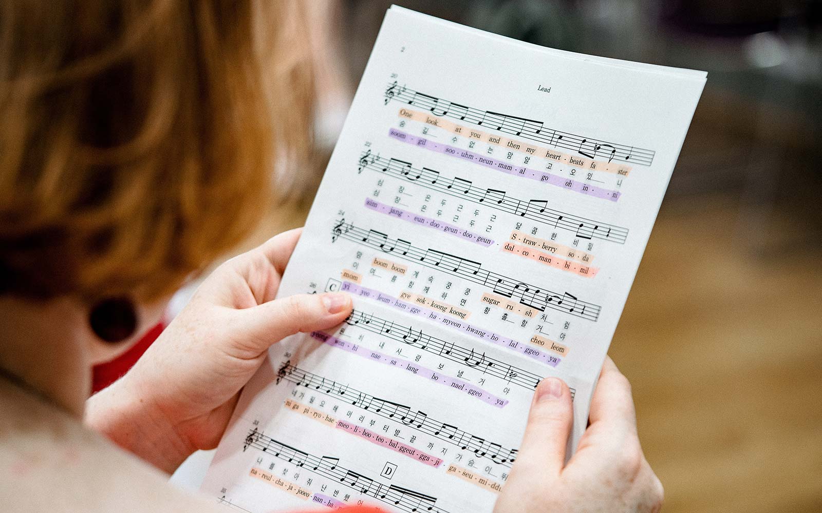 Close up of student reading sheet music