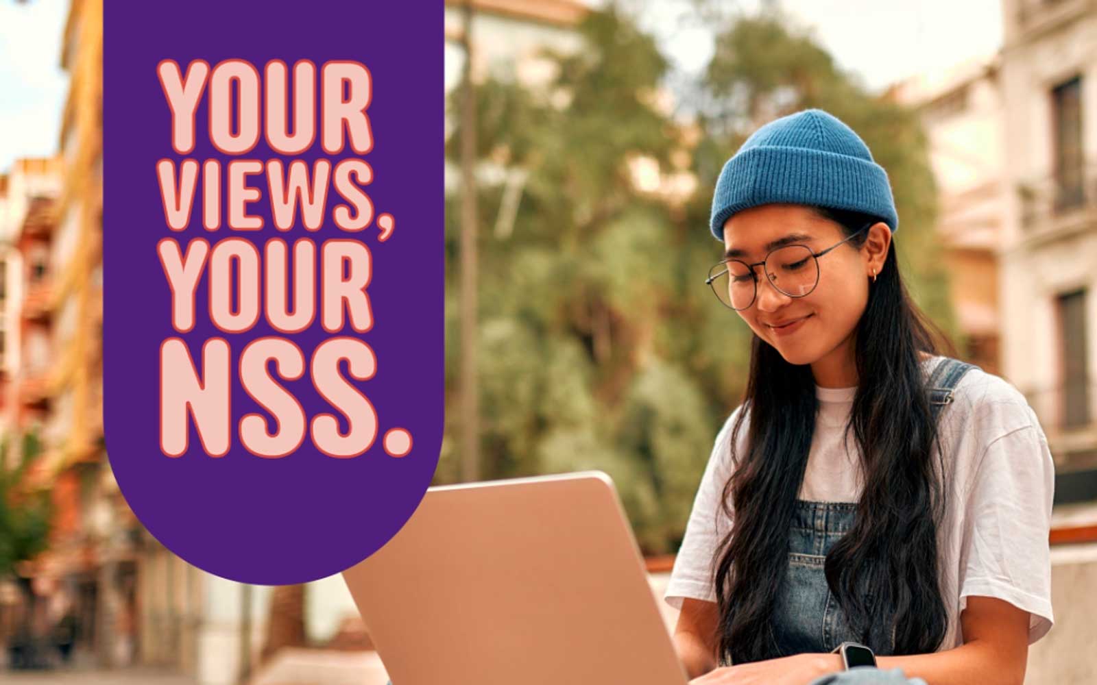 A student with a laptop next to a logo that reads 'Your views, your NSS'.