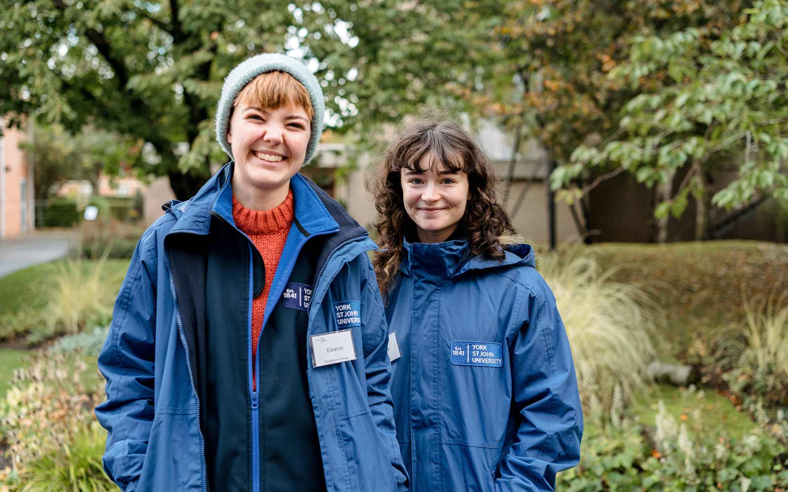 Smiling Student Ambassadors outside on Open Day