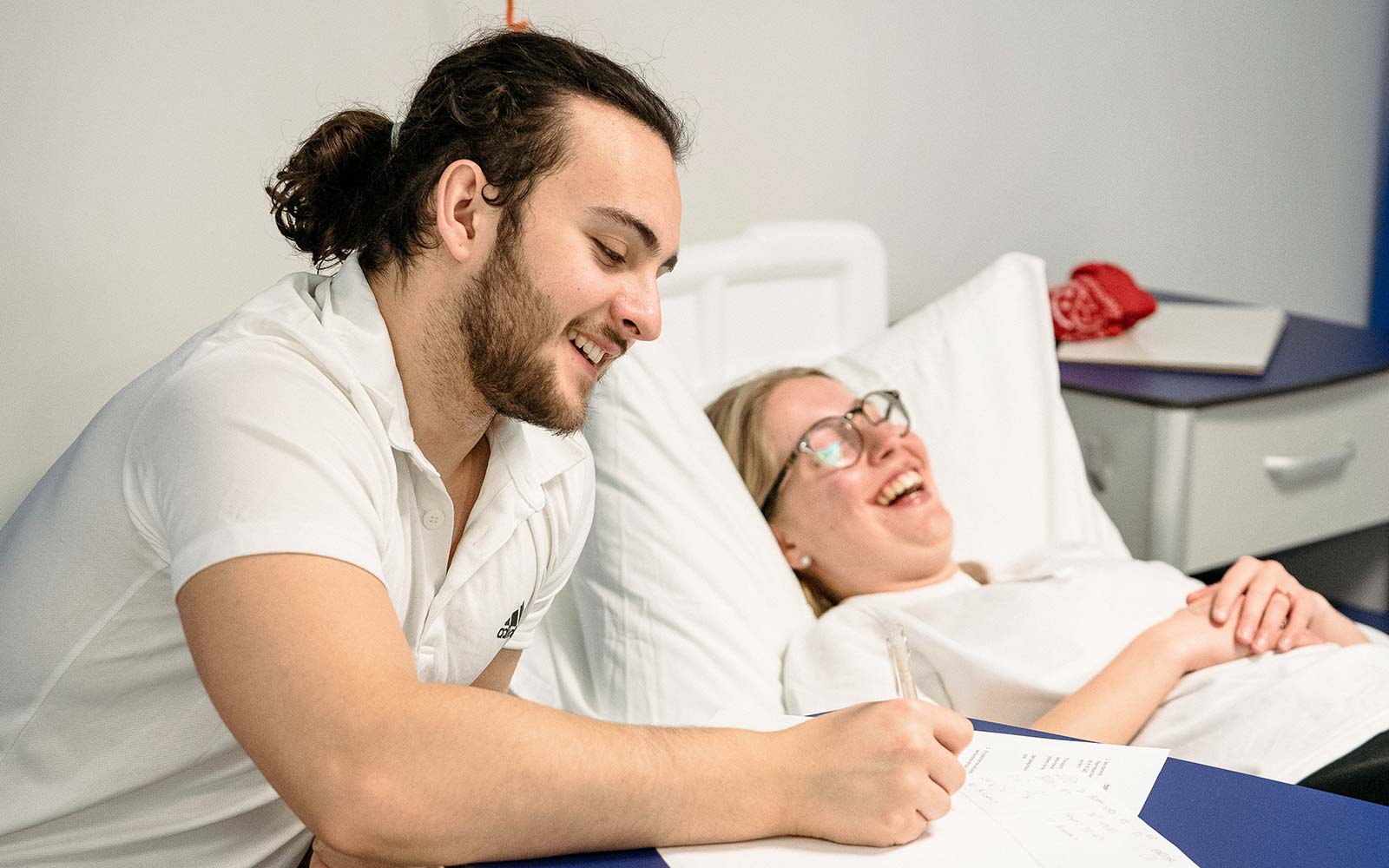 Nursing and physiotherapy students in a practical on the university practice ward.