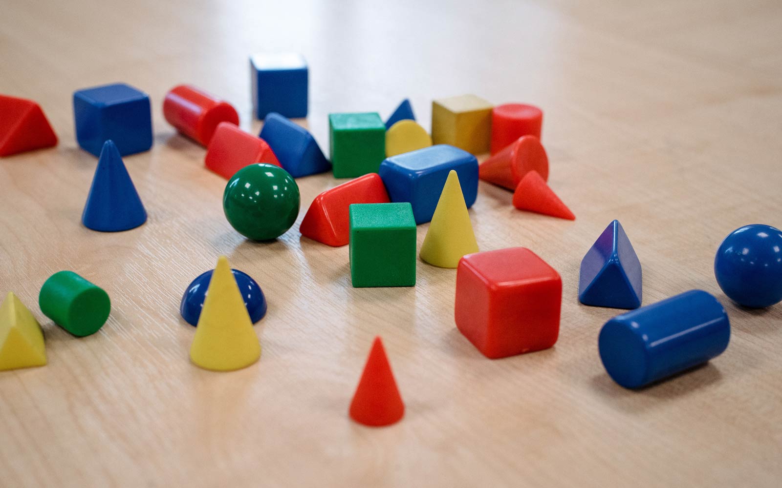 Coloured building blocks on table