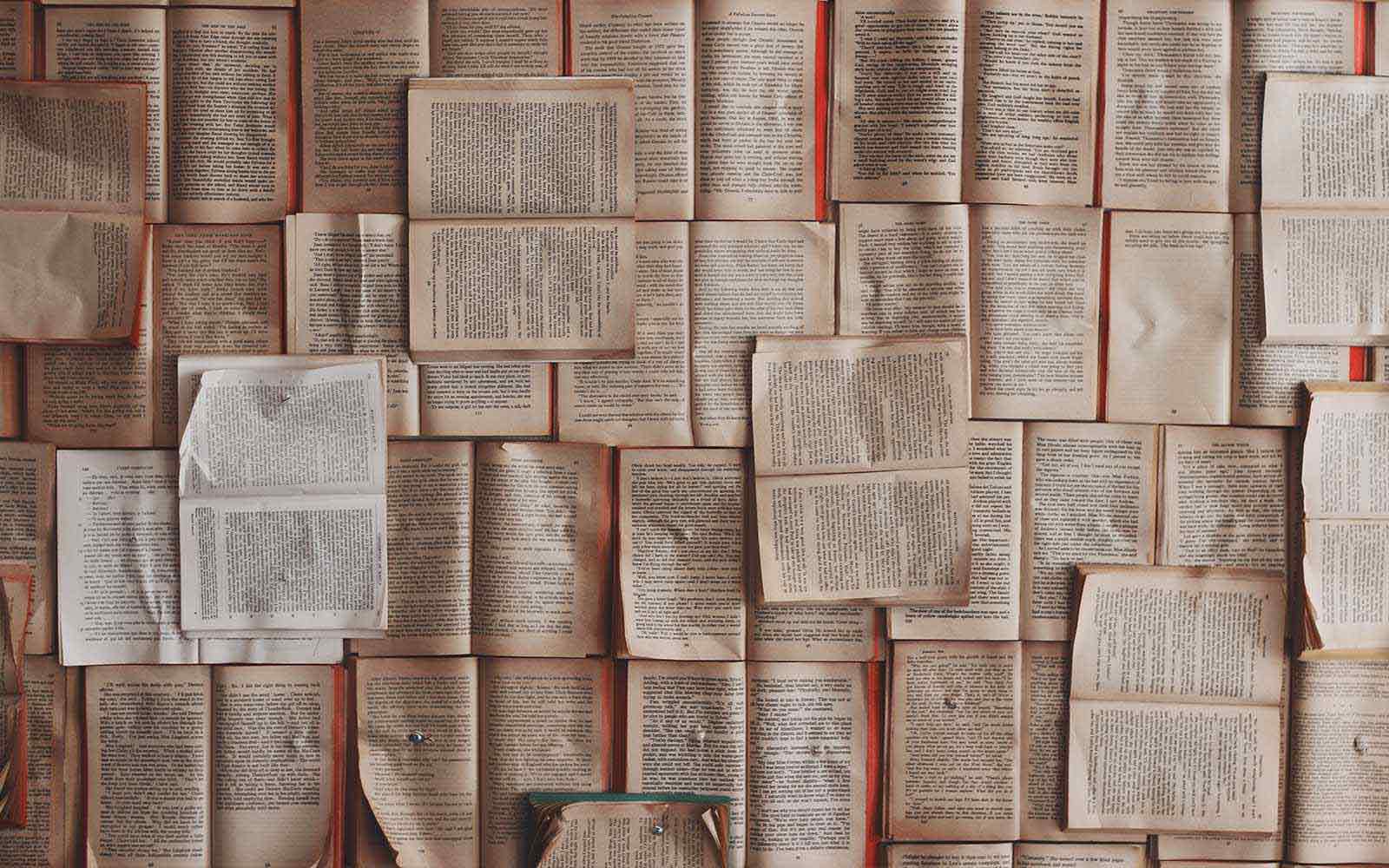 Overhead view of many book pages.