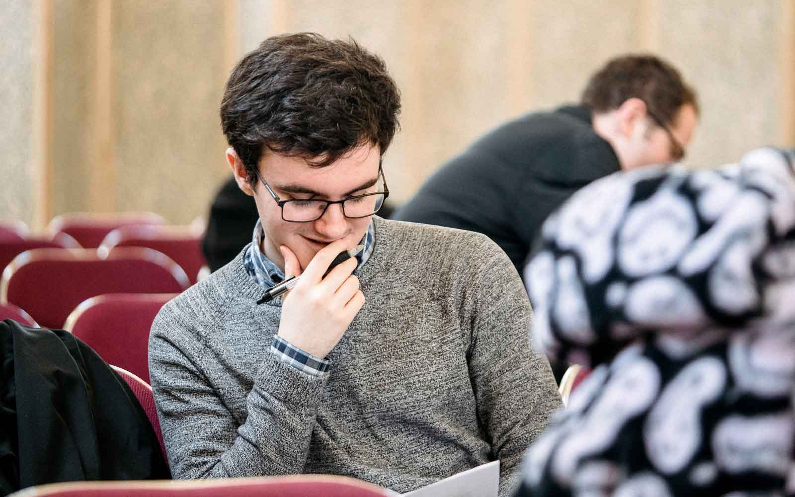 A student reads during class.