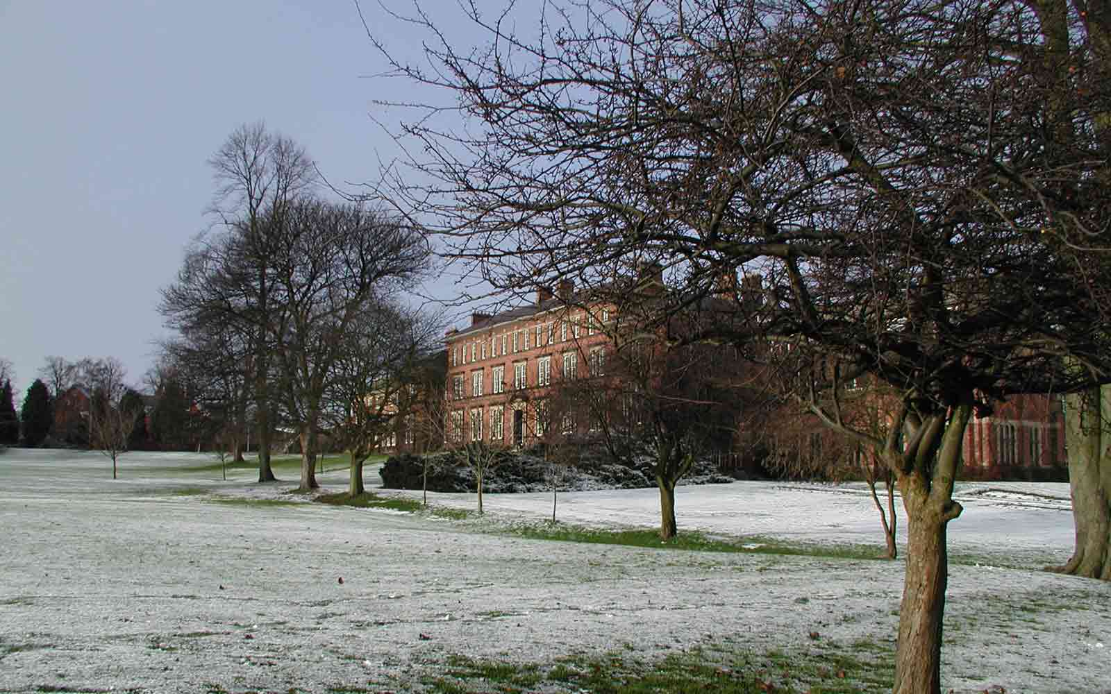 Ripon College surrounded by trees and frost