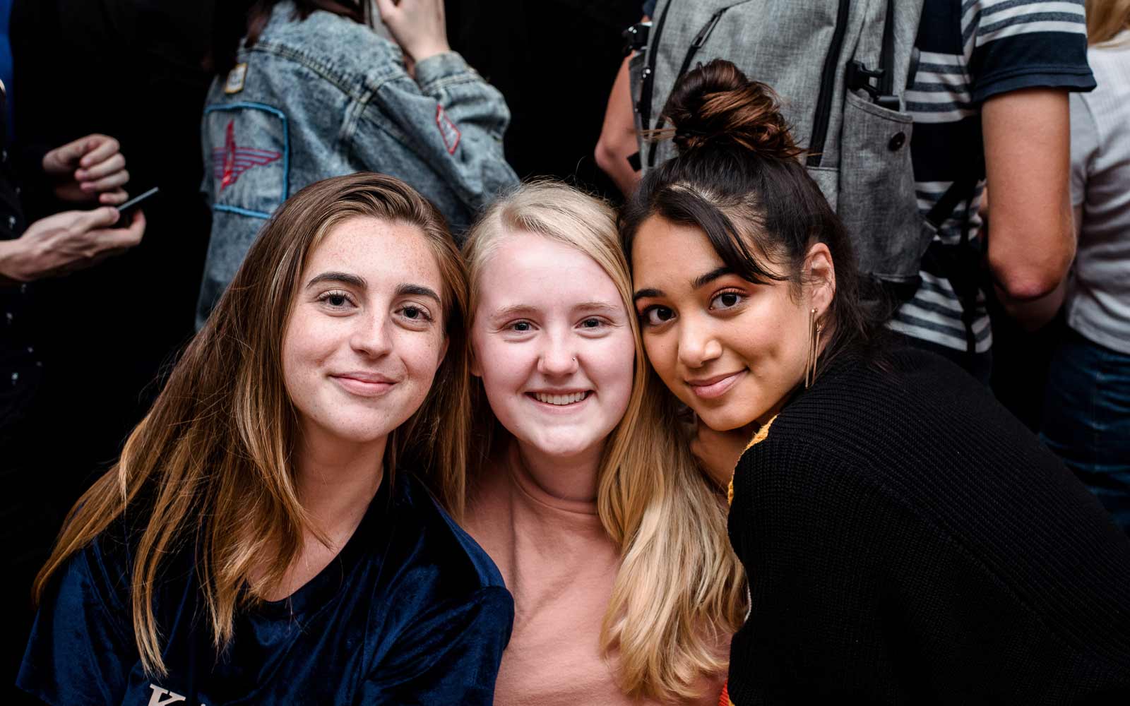 Three students at a Students' Union social.