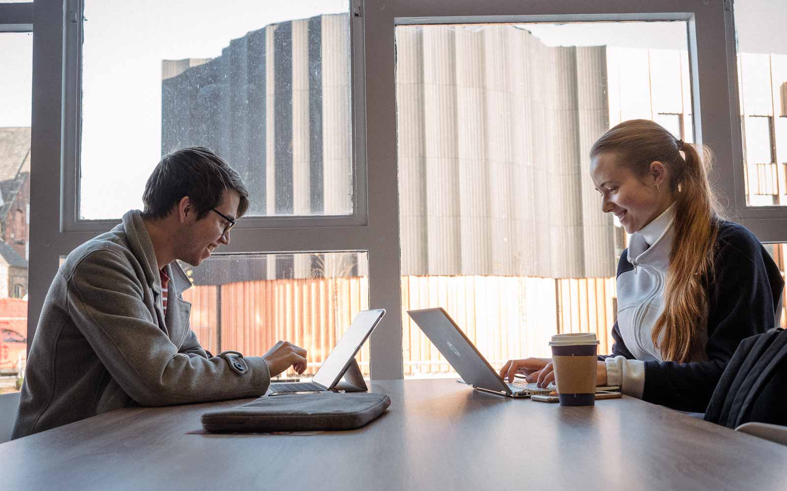 Two students using laptops.