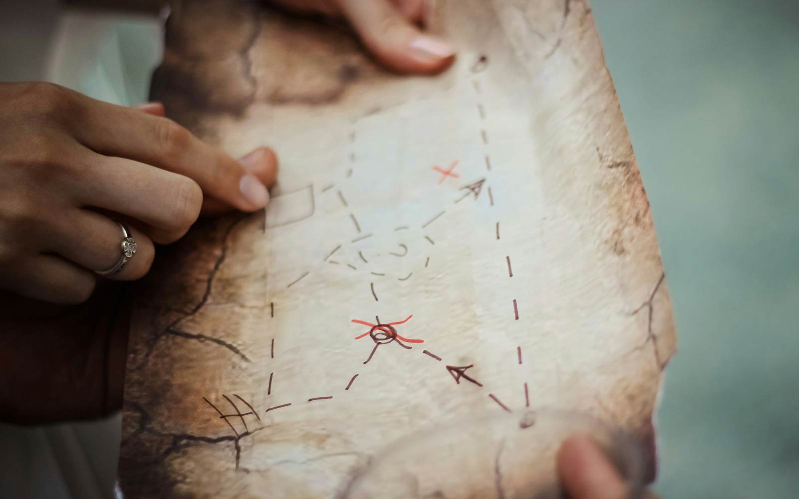 Close of writing on a treasure map. Photo by Natalie on Unsplash.