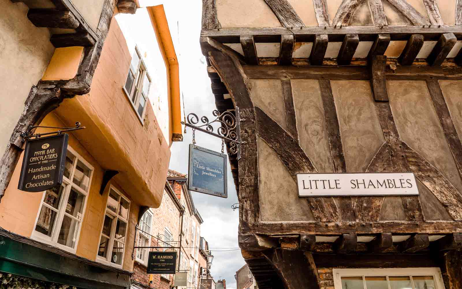 Shops on and near Little Shambles street in York.