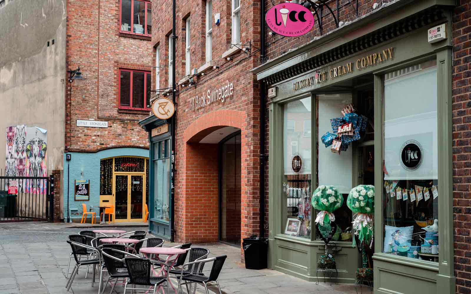 Shops and restaurants along Back Swinegate and Little Stonegate.