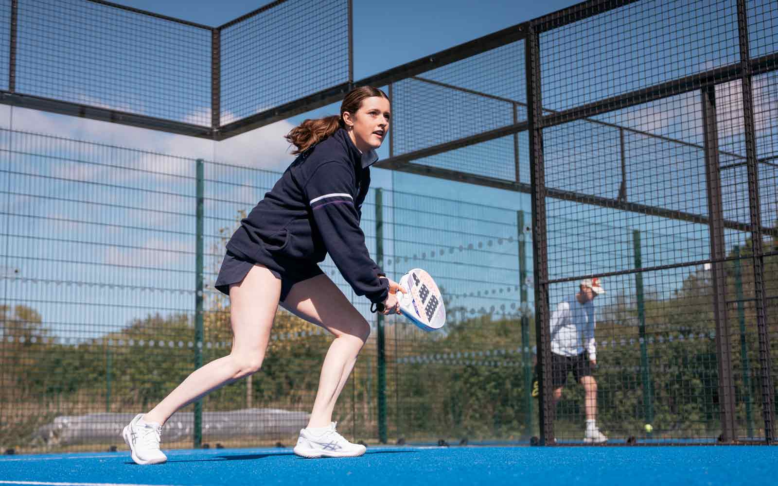 A student playing padel.