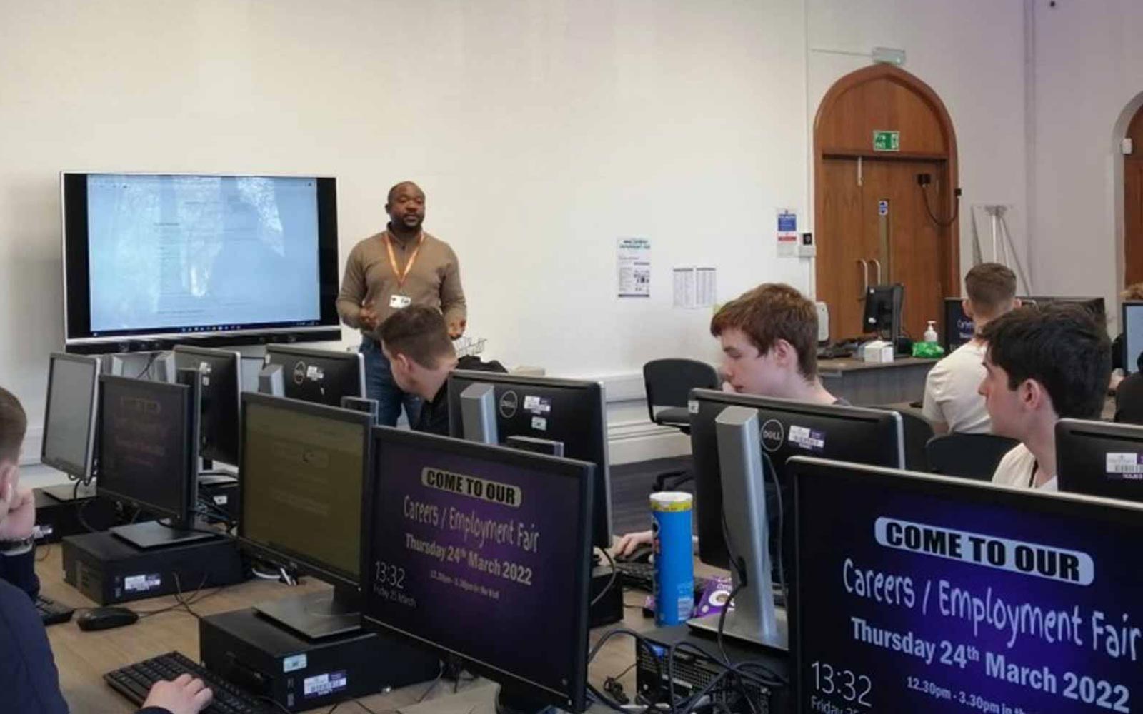 Dr Aminu Usman delivering an outreach cybersecurity session to secondary school students