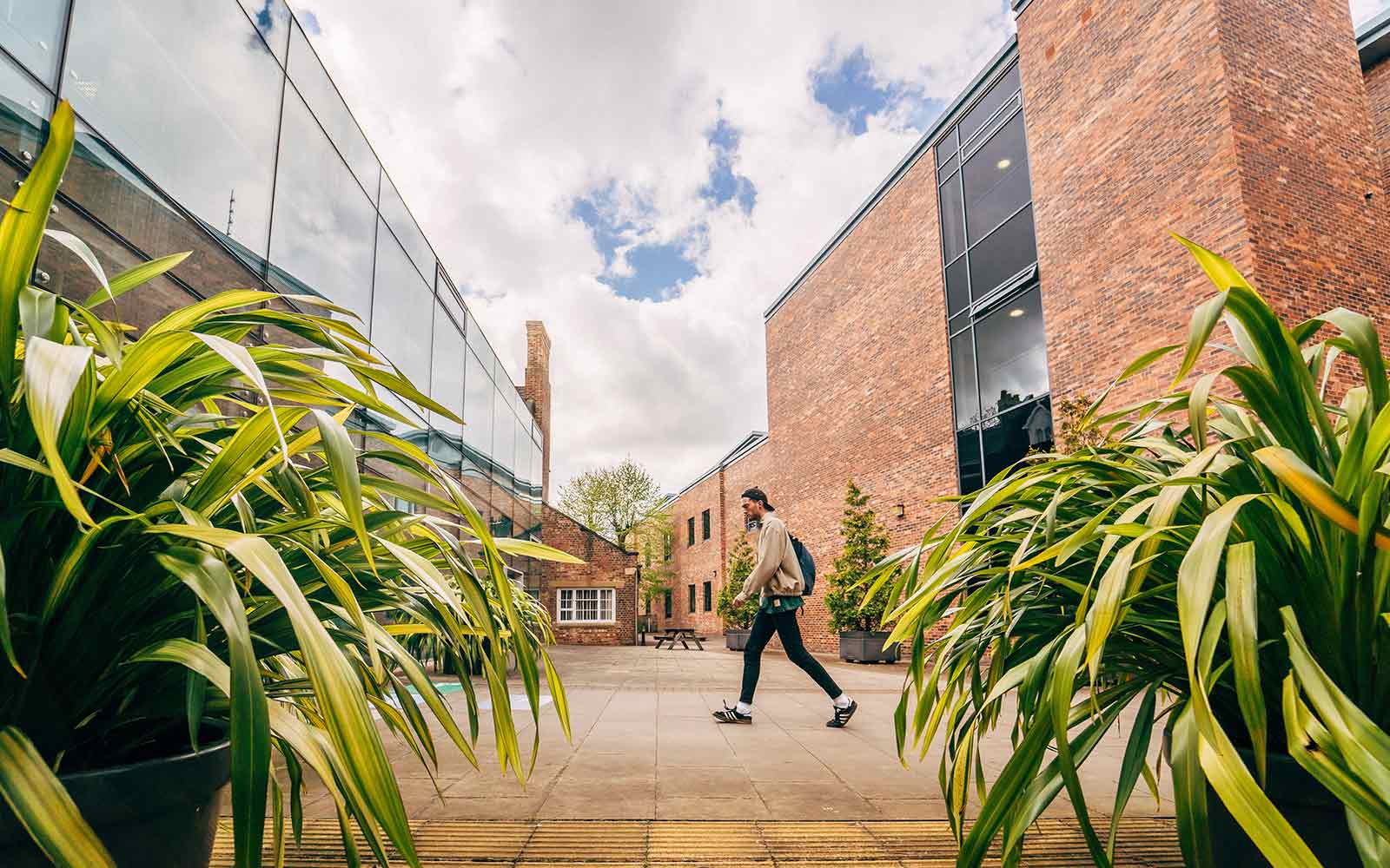 Student walking across campus