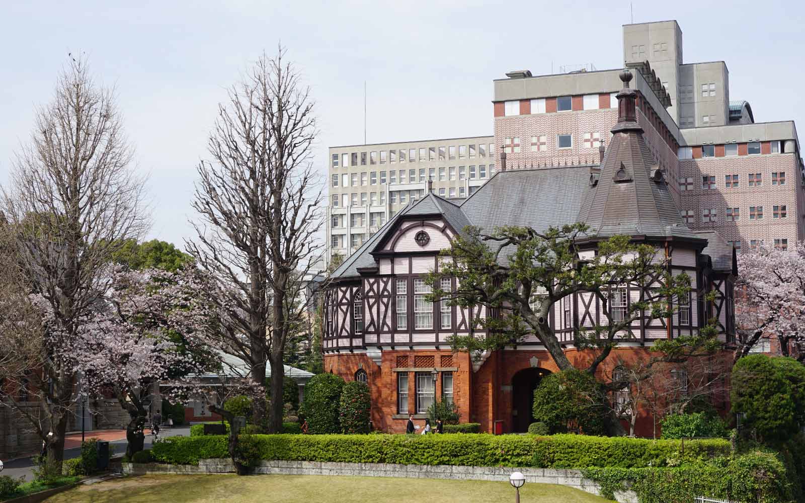 Historical and modern buildings in a park setting at Meiji Gakuin University, Tokyo, Japan.