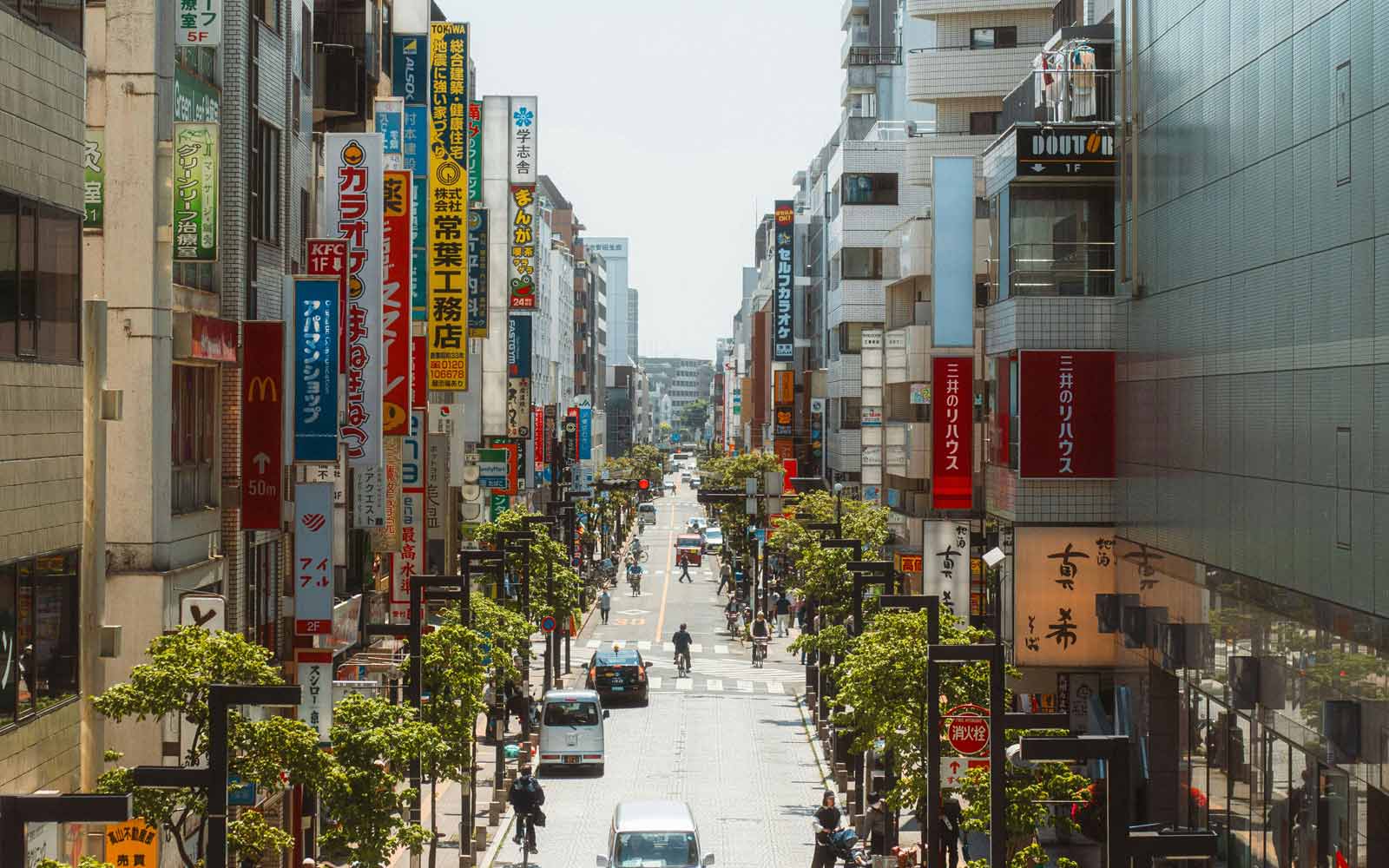 View of a tree-lined street in Mitaka, Western Tokyo, Japan. Photo by Jaipreet Singh on Unsplash.