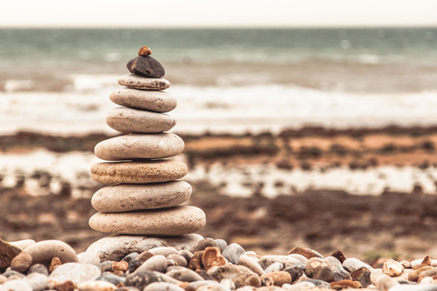 Tower of balanced stones on beach