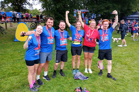 A group of individuals standing together before 10k run